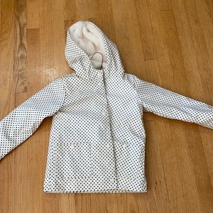 White and black snap front rain coat fur lined so soft hooded and 2 pockets